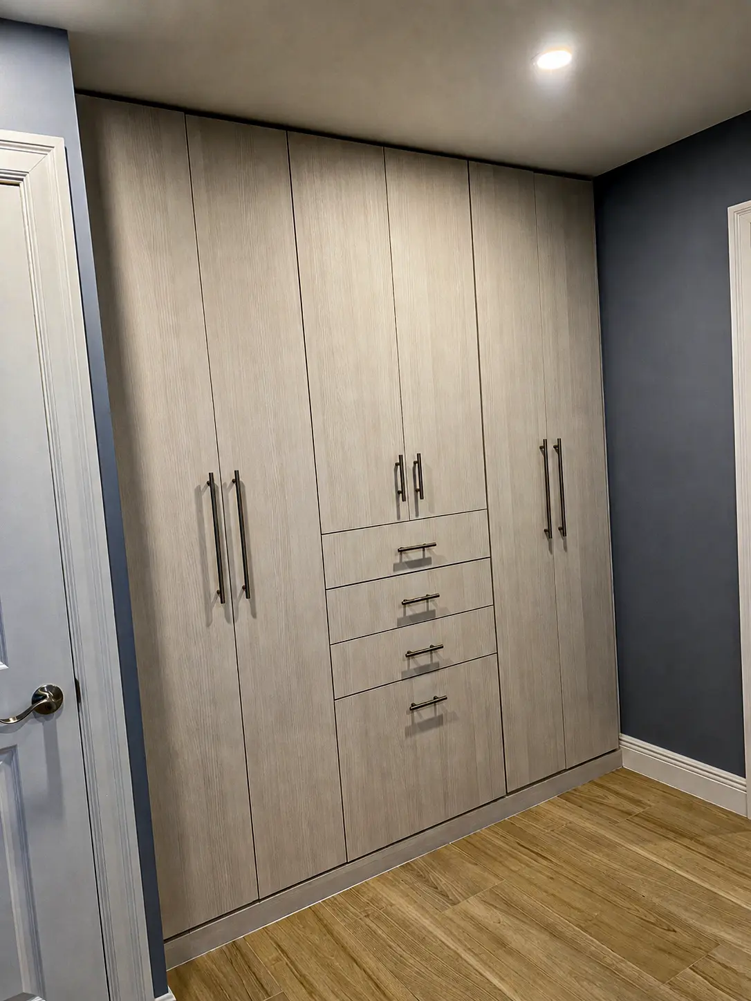A Wardrobe That Closes the Story - Custom built-in wardrobe with driftwood finish in Fort Lauderdale, FL