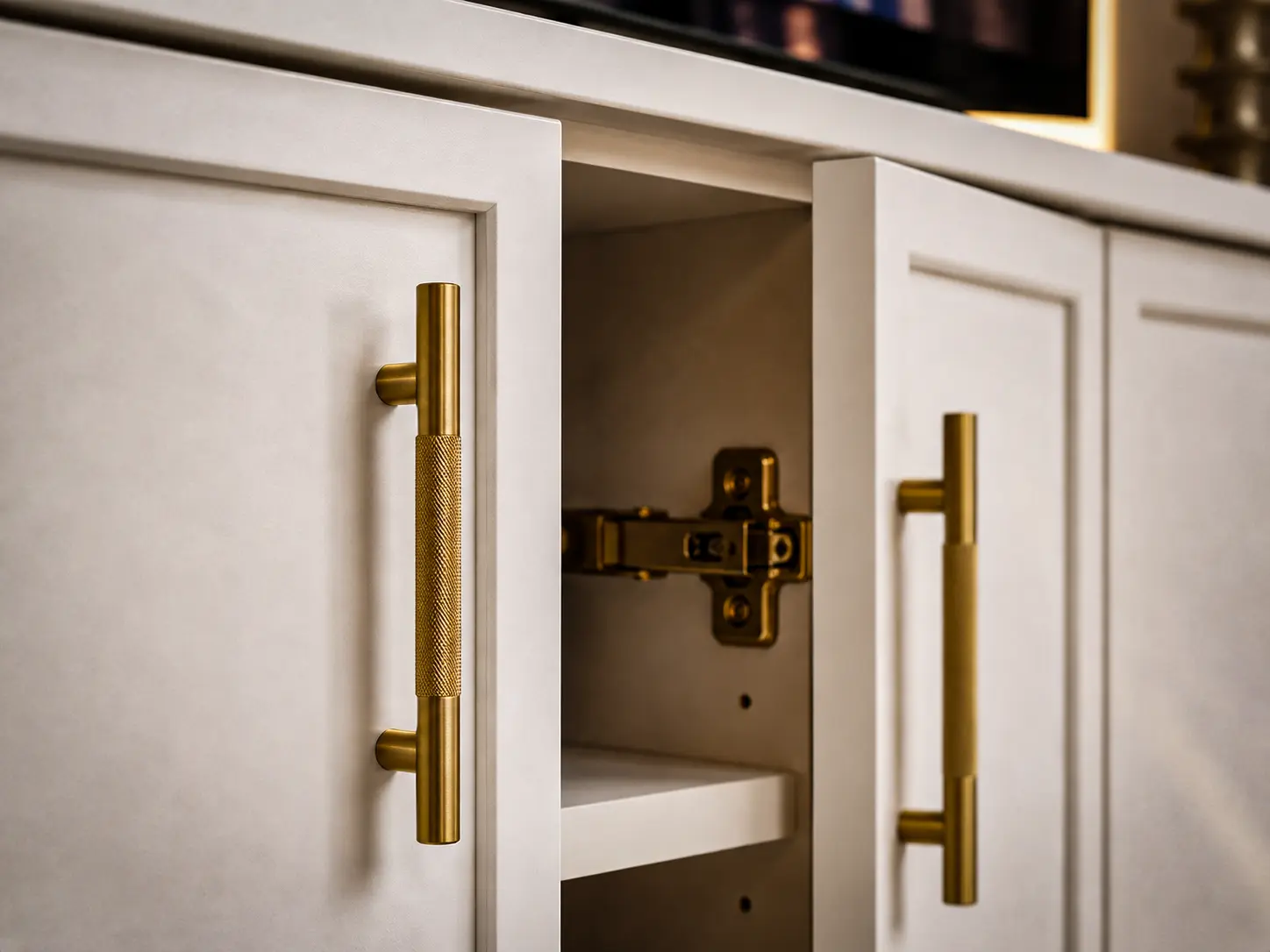 Custom entertainment center with premium hardware and gold handles in South Florida