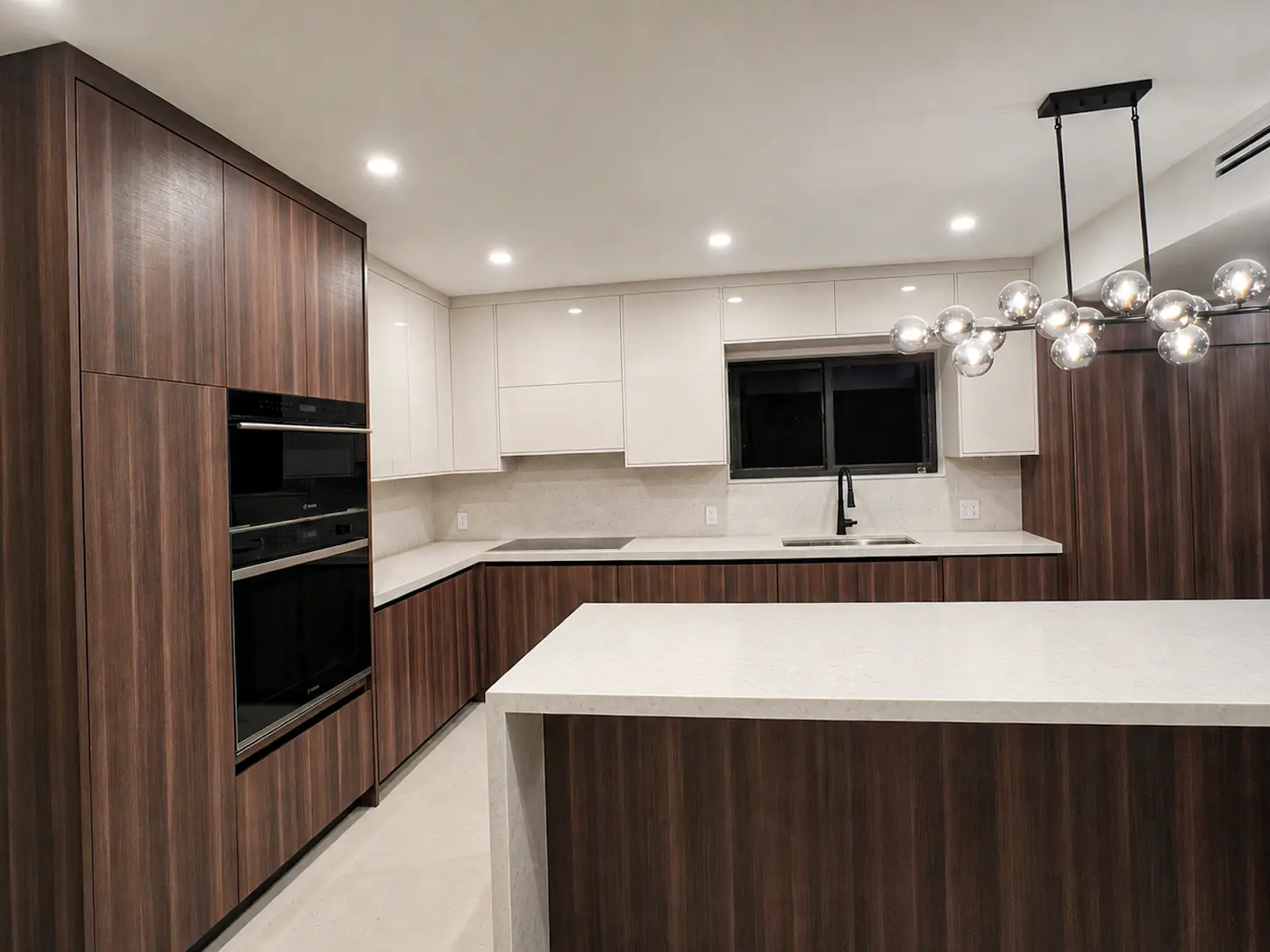 Two-tone kitchen with dark wood and white gloss cabinets in Boca Raton, FL