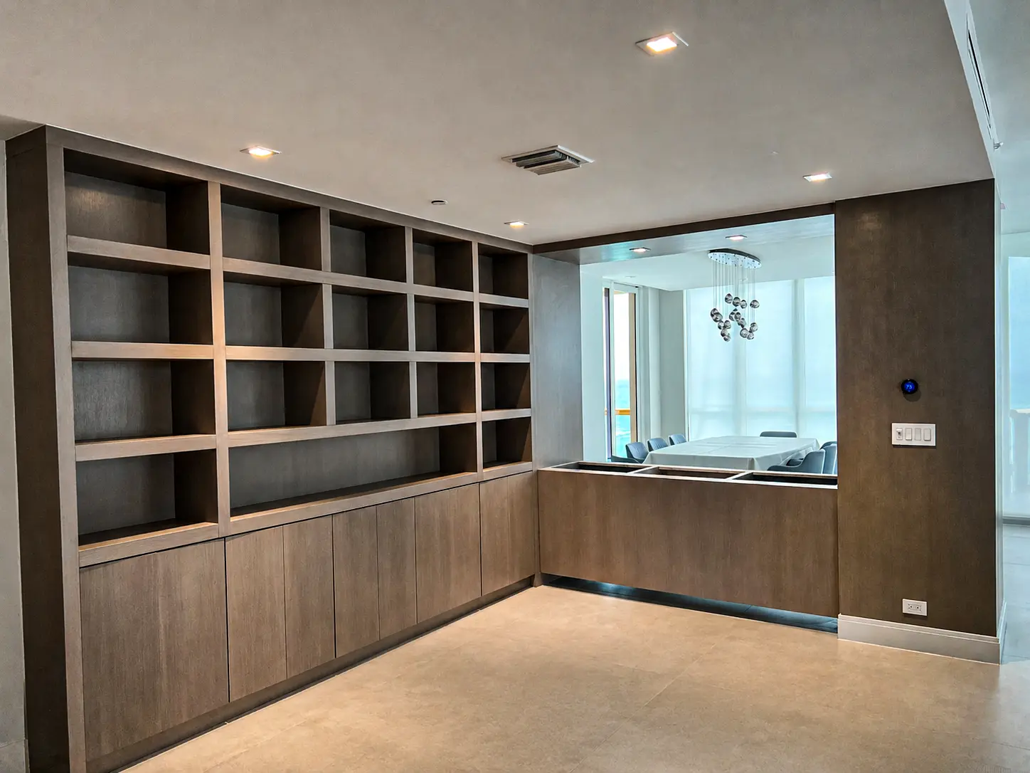 Custom oceanview home office built-in with shelving and desk in Fort Lauderdale, FL