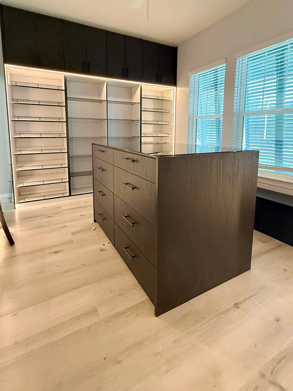 Custom walk-in closet with a center island built by Custom Closet Florida in South Florida