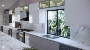 Modern handleless kitchen with gola profile cabinets, white gloss fronts and marble countertop, designed and built by Custom Closet Florida in South Florida