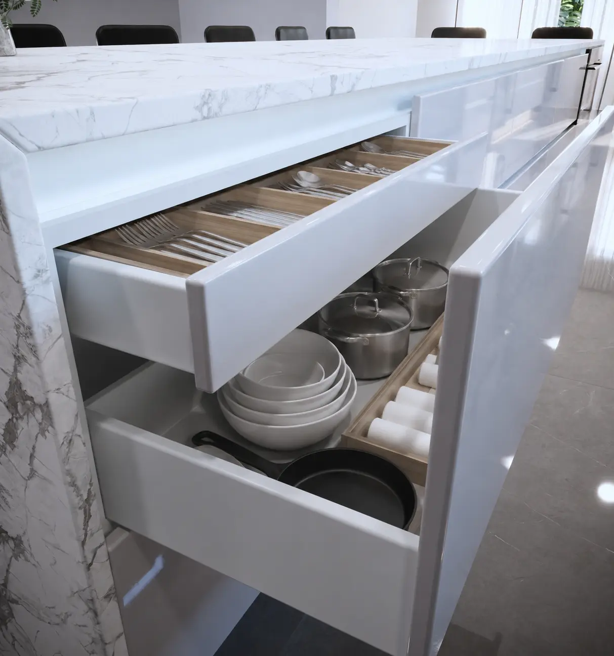 Open handleless kitchen drawers with fitted cutlery insert and organized cookware by Custom Closet Florida