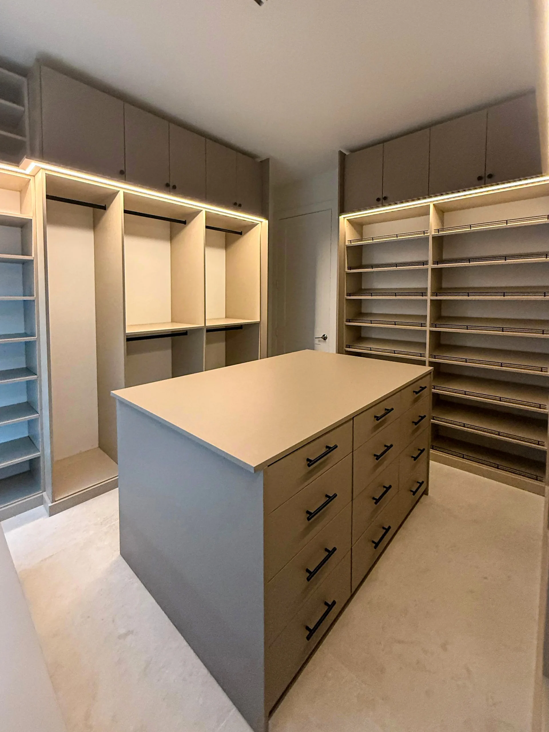 Custom walk-in closet with center island and open shelving installed in Parkland, FL by Custom Closet Florida